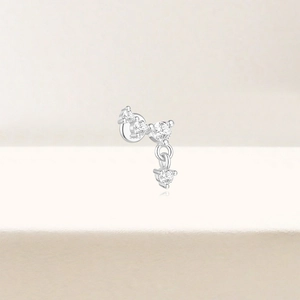 Detailed close-up of a 925 silver lotus earring with sparkling round zircon stones