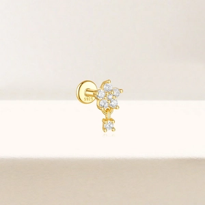 Detail showing S925 engraved silver ear stud with star design and sparkling zircon stones