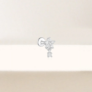 Macro shot of S925 sterling silver star stud earring with pavé zircon and drop pendant