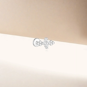 Detailed macro view of S925 sterling silver lotus stud with sparkling zircon gemstones