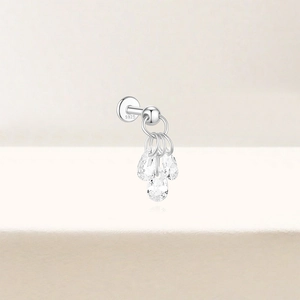 Macro detail of S925 sterling silver stamp and three pear-shaped zirconia studs