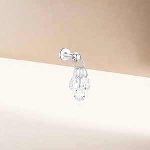 Detailed macro view of S925 sterling silver piercing stud with three crystal teardrops