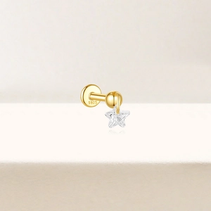 Detailed macro shot of S925 sterling silver star cartilage stud with cubic zirconia
