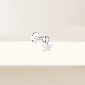 Close-up of S925 sterling silver labret stud with crystal star and hallmark detail