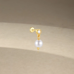 Detailed close-up of S925 sterling silver labret stud with zircon and white bead charm