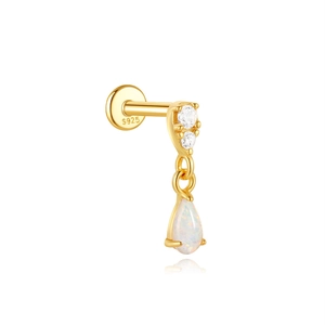 Detailed macro of gold S925 silver clover stud with opal and zircon gemstones
