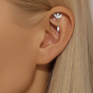 Close-up of S925 silver ear cuff featuring marquise zircon leaves and a dangling stone