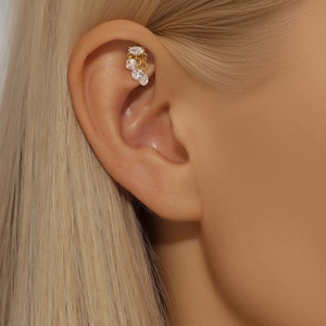 Detail of S925 silver ear cuff with marquise and round cubic zirconia in gold plating