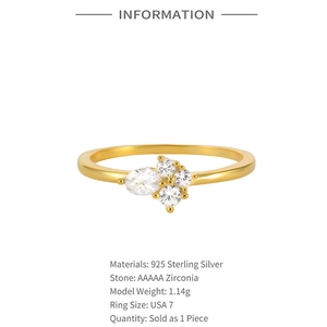 Macro detail of gold S925 sterling silver ring with cluster AAAAA white zirconias