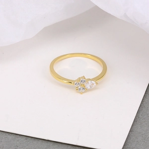 Macro detail of gold plated S925 silver ring featuring pear-cut and round crystals
