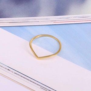 Macro view of gold-plated S925 sterling silver V-shaped ring with polished finish