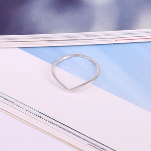 Detailed view of S925 sterling silver stamp on minimalist V-shaped wedding ring