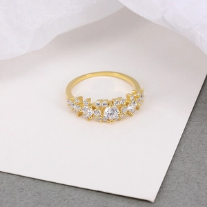 Macro detail of gold S925 silver wedding ring with multi-stone prong-set zircon display