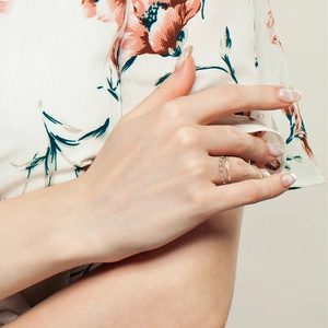 Detail of s925 silver double-layered stackable gold rings with micro-inlaid diamonds