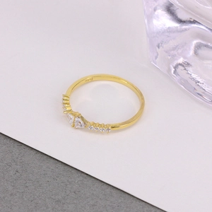Macro shot of S925 hallmark on a gold-plated sterling silver ring with white zircons