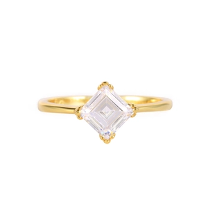 Macro shot of gold S925 silver ring featuring a square step-cut diamond in 4-prong setting