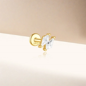 Detailed macro view of S925 sterling silver gold stud earring with trapezoidal zircon stones