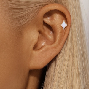 Detailed close-up of S925 silver 18K gold plated cartilage stud with opal and zircon