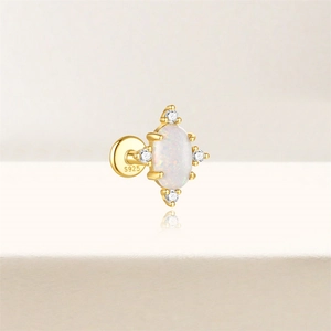 Detailed macro view of S925 silver gold star stud featuring opal and zircon stones
