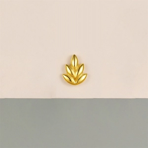 Detailed view of a golden wheat grain stud earring with polished opal leaf accents
