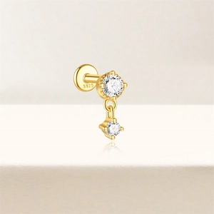 Detail of s925 silver gold stud earring with round and square clear cubic zirconia stones