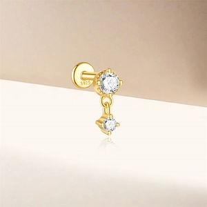 Detail of S925 sterling silver gold-plated labret stud with sparkling zircon stones