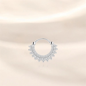Macro detail of s925 silver septum ring with double-layered pavé moissanite stones