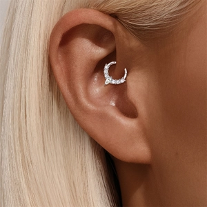 Close-up of S925 sterling silver ear hoop with marquise and round cubic zirconia stones