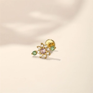 Macro view of gold s925 silver floral cartilage stud with pink heart stone and crystals