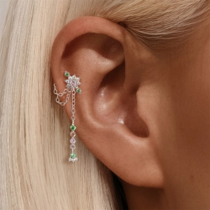Detail of s925 silver cartilage stud with colorful floral gems and dangling chains