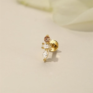 Macro detail of a gold labret stud with champagne and marquise cut crystal stones