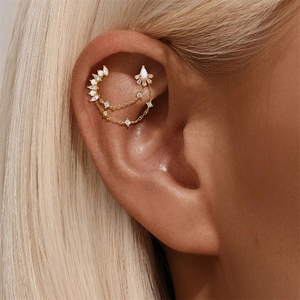 Detailed close-up of gold S925 sterling silver chain earrings with marquise stones