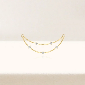 Macro detail of S925 sterling silver long chain earrings with five round zircon stones