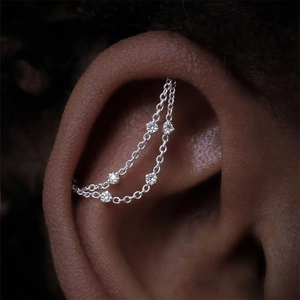 Close-up of S925 sterling silver double chain ear cuff with five shiny cubic zirconia