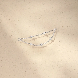 Close-up of S925 silver chain with five prong-set round white cubic zirconia gemstones