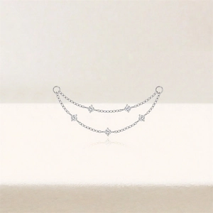 Detailed view of silver double-layered chain earring accessory with inlaid zircons