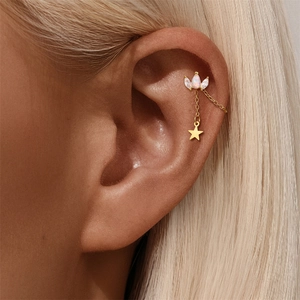 Detailed shot of gold chain earring with marquise opal cluster and tiny star pendant