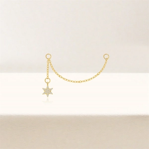 Close-up of S925 silver chain with 18K gold star pendant and sparkling crystals