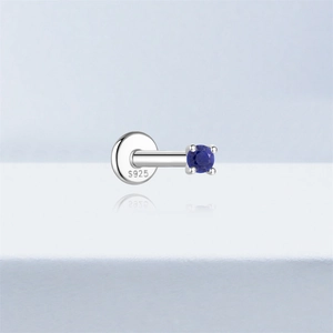 Detail of S925 sterling silver flat back labret with blue lapis lazuli stone inlay