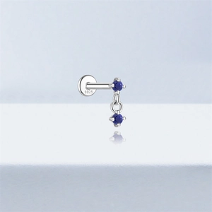 Macro shot of S925 sterling silver earring with blue stones and hallmark detail
