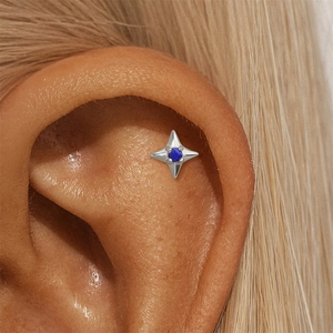 Detailed view of an S925 silver star-shaped stud earring with a blue lapis lazuli stone