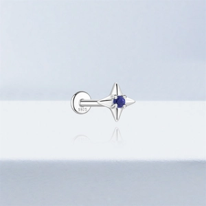 Macro view of S925 sterling silver clover stud with round blue lapis lazuli stone