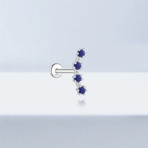 Macro detail of S925 sterling silver ear stud featuring four round blue lapis stones