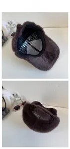 Detail view of plush brown faux fur baseball cap featuring soft texture and black inner lining