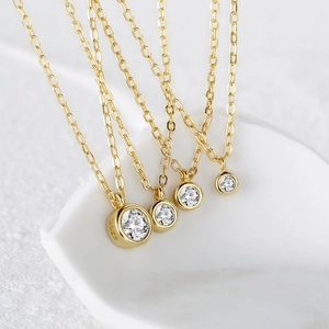 Detailed macro view of S925 sterling silver necklaces in four sizes with bezel-set zircons