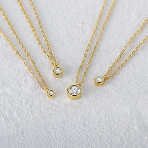 Detailed comparison of four sizes of solitaire diamond necklaces in gold finish