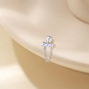Macro shot of S925 sterling silver moonstone stud earring with cross link chain detail