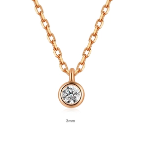 Macro view of 3mm solitaire pendant on a rose gold necklace with a secure bezel setting