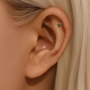 Close-up of a s925 gold-plated stud earring featuring a round green moss agate stone