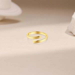 Detail shot of polished gold-plated S925 sterling silver adjustable wave toe ring